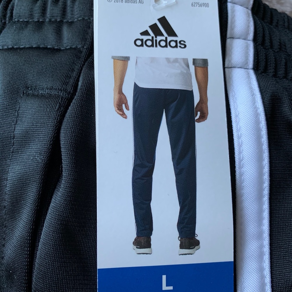 SOLD. Adidas men’s striped pants brand new & tags